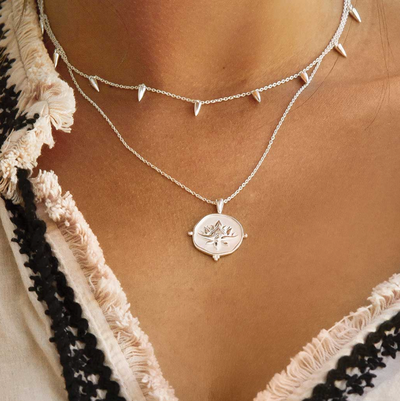 a sterling silver necklace with a blooming lotus design pendant by murkani