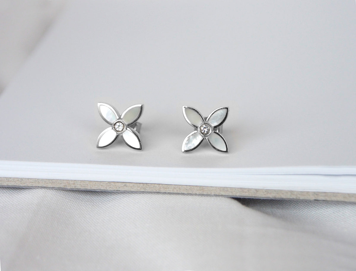desert flower sterling silver stud earrings by murkani have mother of pearl and white topaz