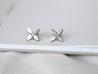 desert flower sterling silver stud earrings by murkani have mother of pearl and white topaz