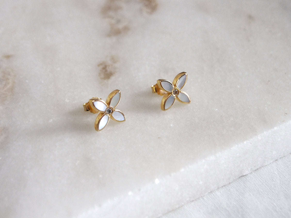 desert flower yellow gold stud earrings by murkani have mother of pearl and white topaz
