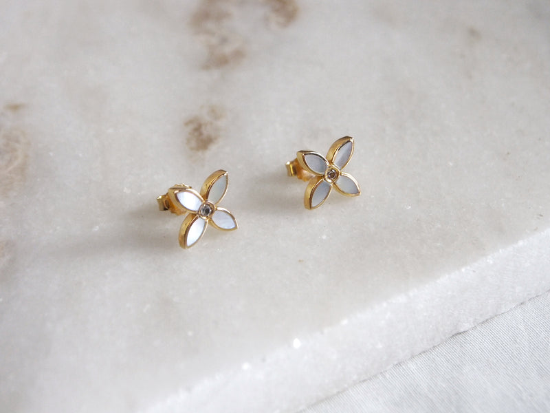 desert flower yellow gold stud earrings by murkani have mother of pearl and white topaz